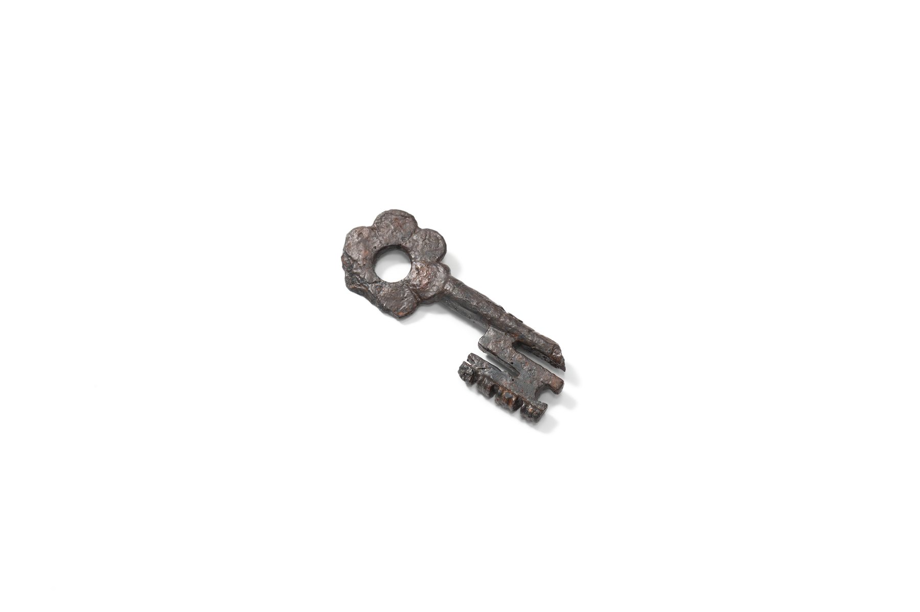 Iron key with a rosette-shaped bow. 14th–15th century.    