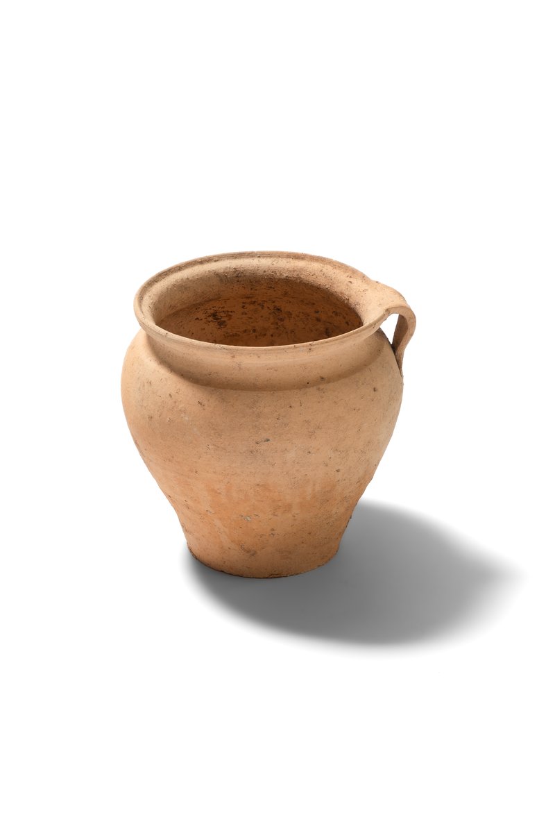 Ceramic cooking pot with a handle, wheel-thrown from fine-grained pottery clay. 16th–17th century. 
