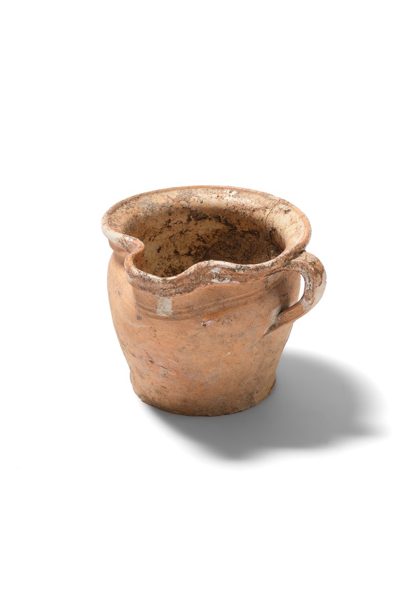 Ceramic mug with a handle, wheel-thrown from very fine-grained pottery clay; glazed rim and interior. Second half of the 16th–17th century. 